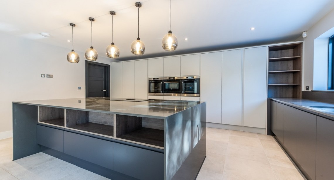Kitchen with feature lighting over the island 